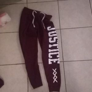 Burgundy tights/sweatpants.